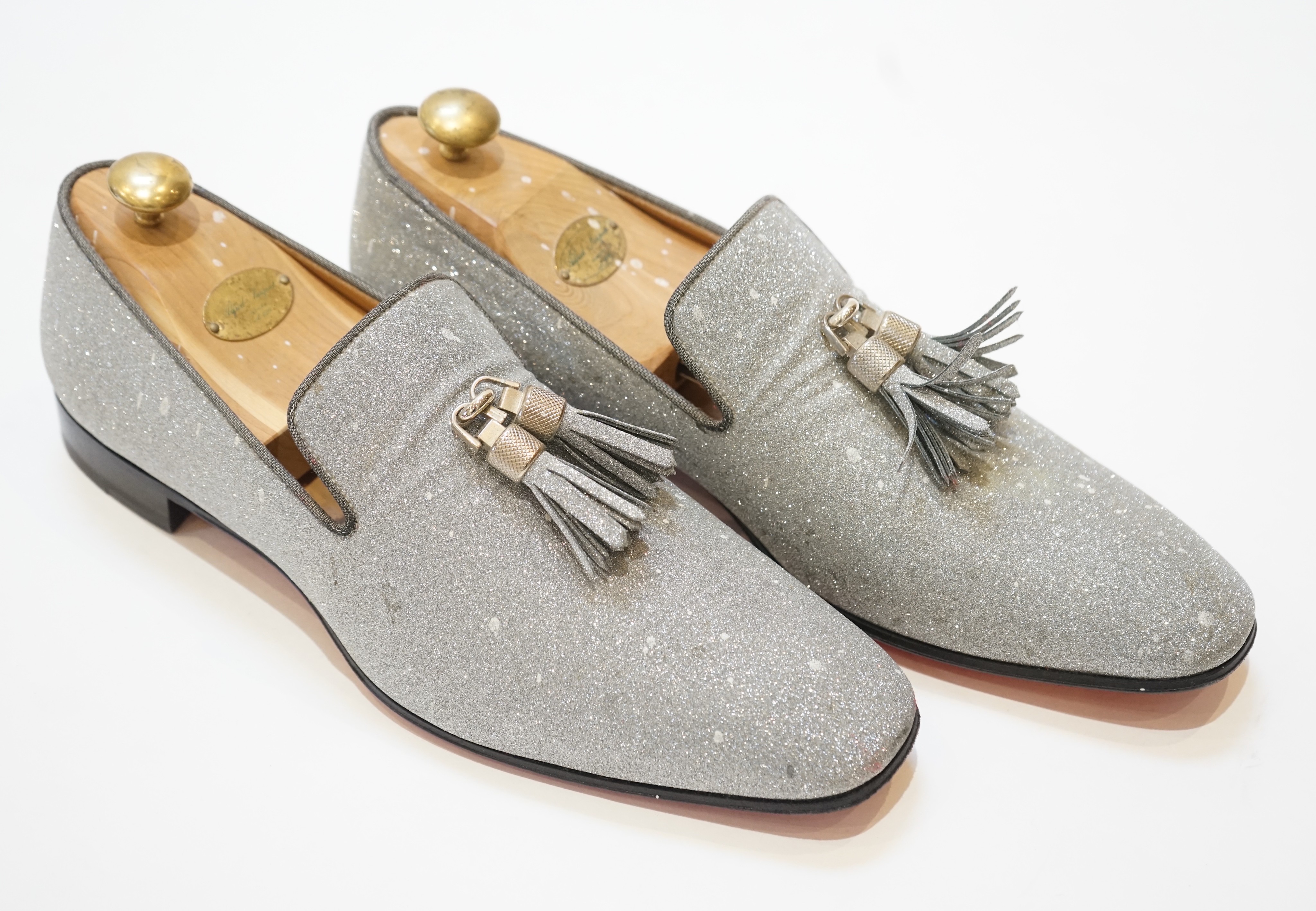 A pair of gentleman's Christian Louboutin silver glitter tasselled loafers, in shoe bag, size 42.5